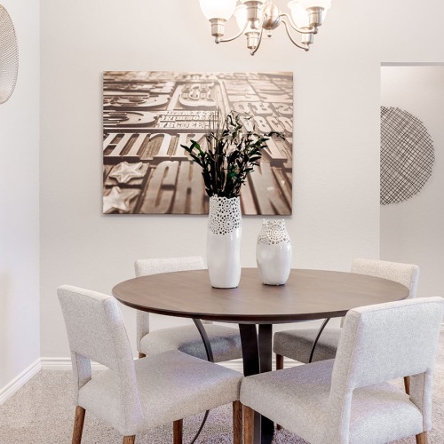 Spacious and well-lit living spaces dining room with tasteful decor