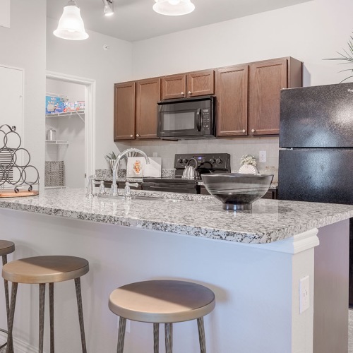 Spacious kitchens with thoughtful details a kitchen with an island