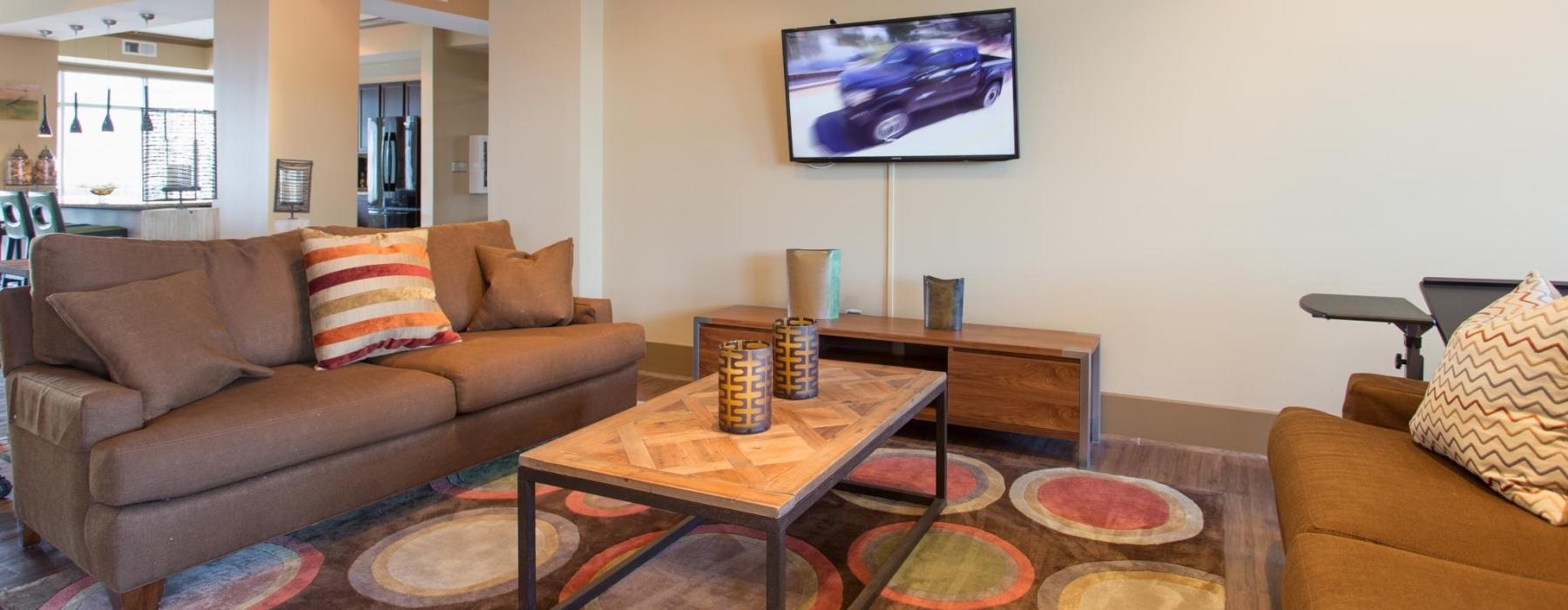 a living room with a tv and couches